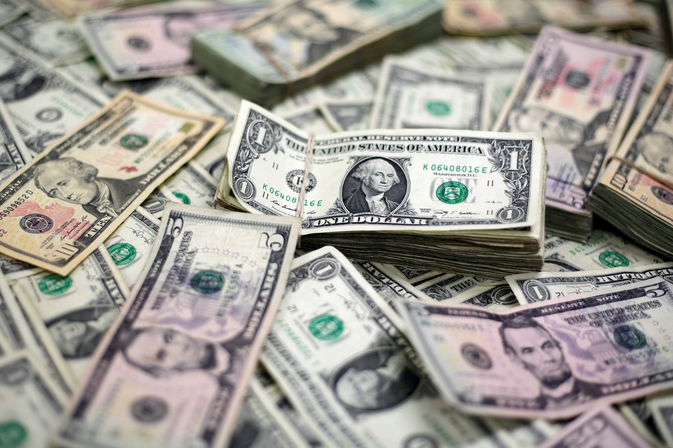 U.S. Dollar banknotes are seen in this photo illustration
