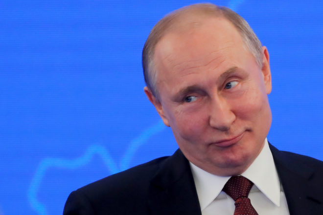 Russian President Vladimir Putin attends a session of the Week of Russian Business in Moscow