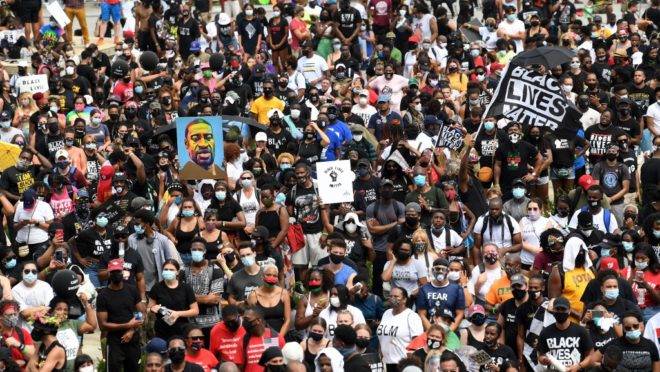 'Get Your Knee Off Our Necks' march against police violence and racism