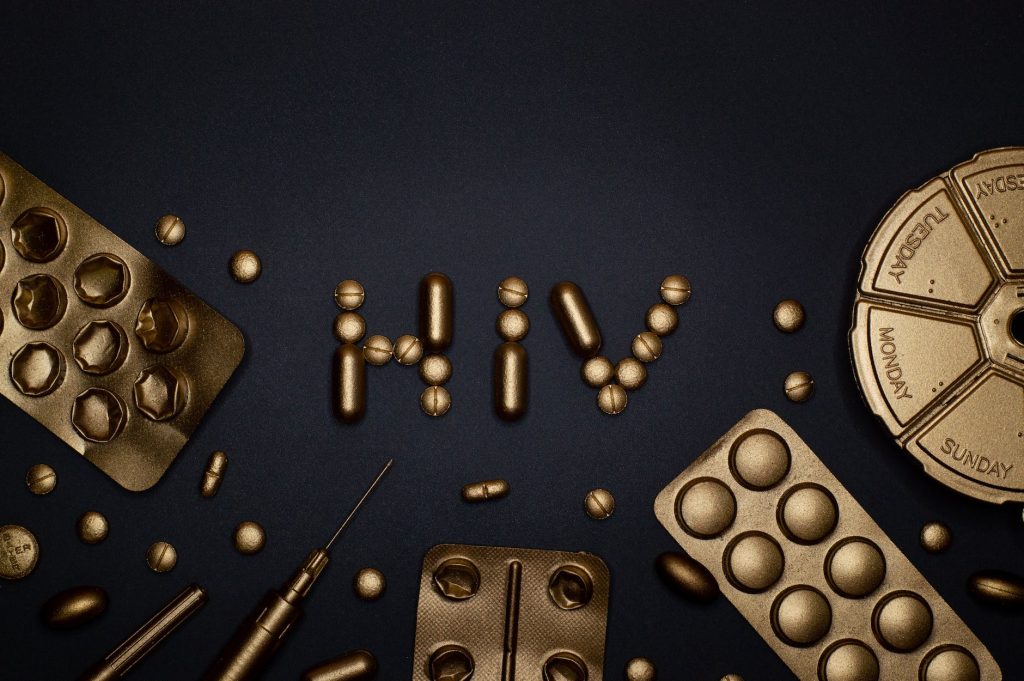 syringe and pills on blue background