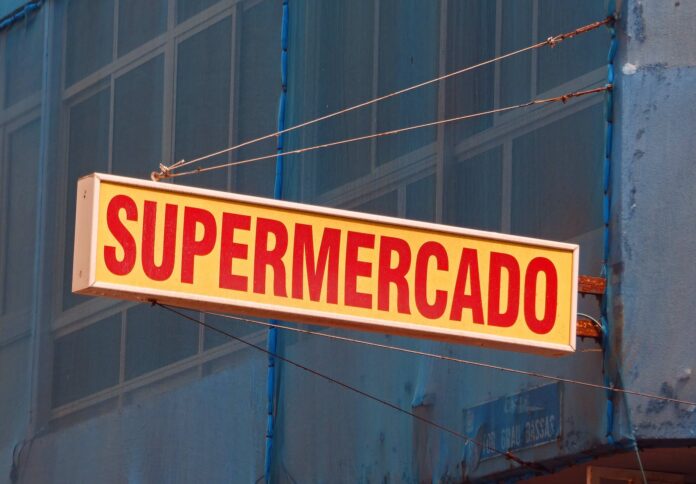 red and yellow colored sign on a building