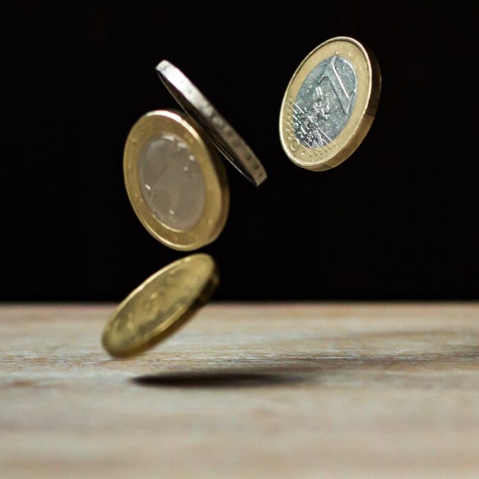 pexels-photo-210600 coins on brown wood