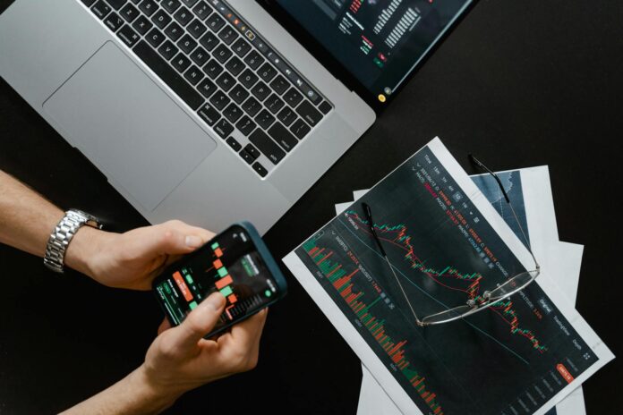 pexels-photo-7567443 hands holding a smartphone with data on screen