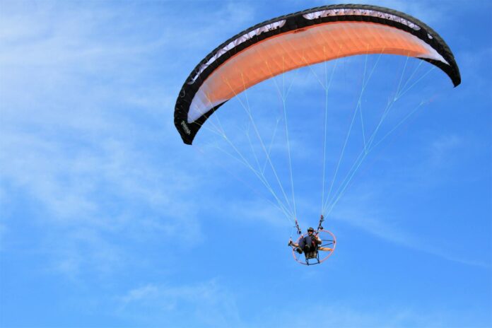 pexels-photo-6478078 person paragliding in the air