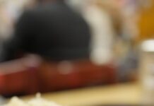 close up of sauerkraut topped hot dog