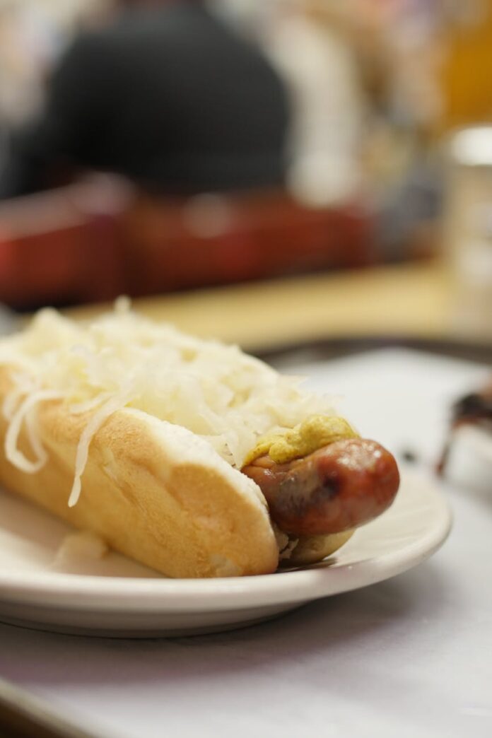 close up of sauerkraut topped hot dog