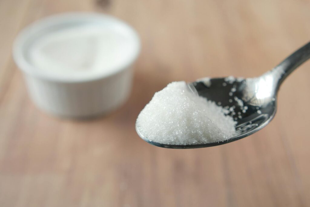 sugar in metal spoon