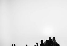silhouette of people at mumbai beach sunset