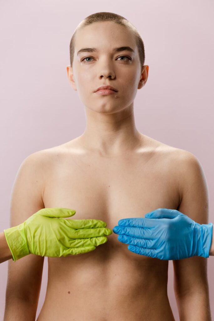 woman in blue tube dress with green gloves on her head