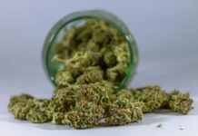 green kush in glass bottle