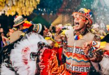 smiling man in traditional clothing at event