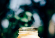clear glass jar on block