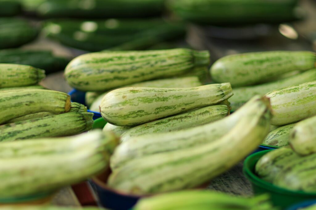 close up of fresh zucchini display in market