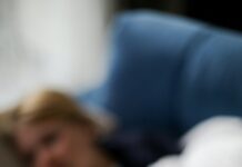 a person holding a thermometer