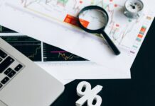 black smartphone on white notebook