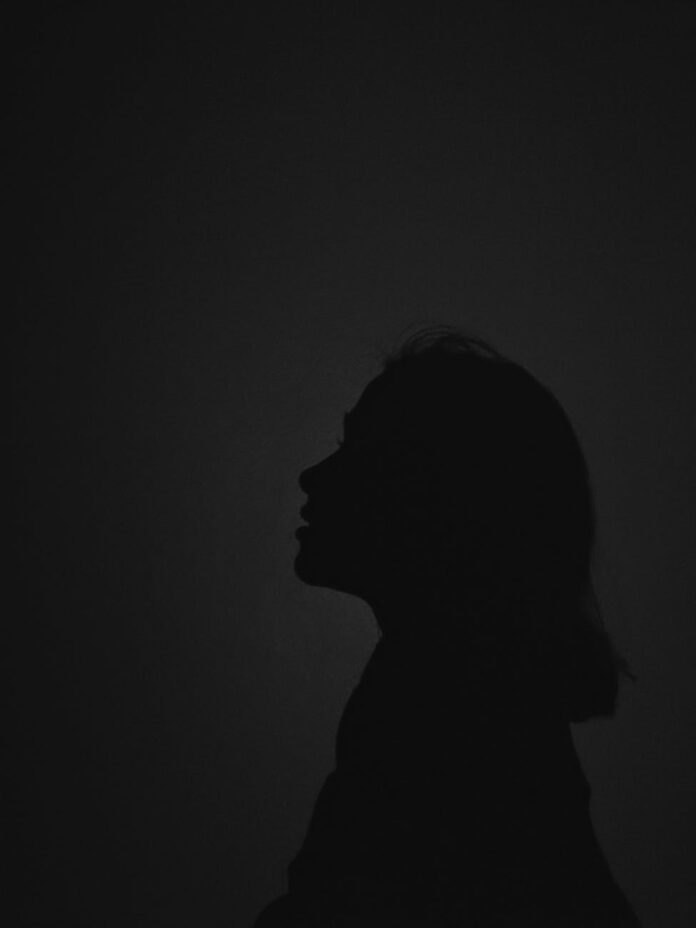 pexels-photo-7977495 silhouette of person with dark background