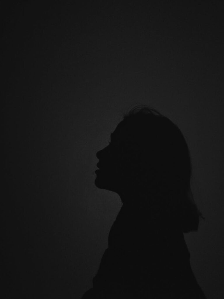 silhouette of person with dark background