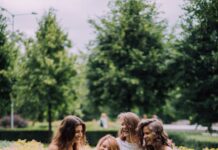 happy people standing at a garden