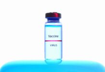 a close up view of a vaccine vial on white background