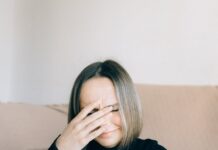 a woman in black long sleeve shirt sitting at the table