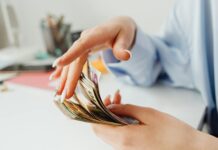 person holding american dollars