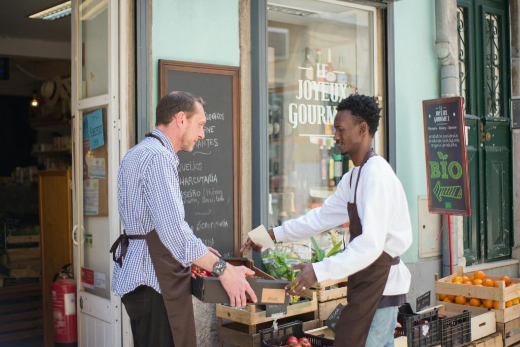 men arranging the fruits and vegetables
