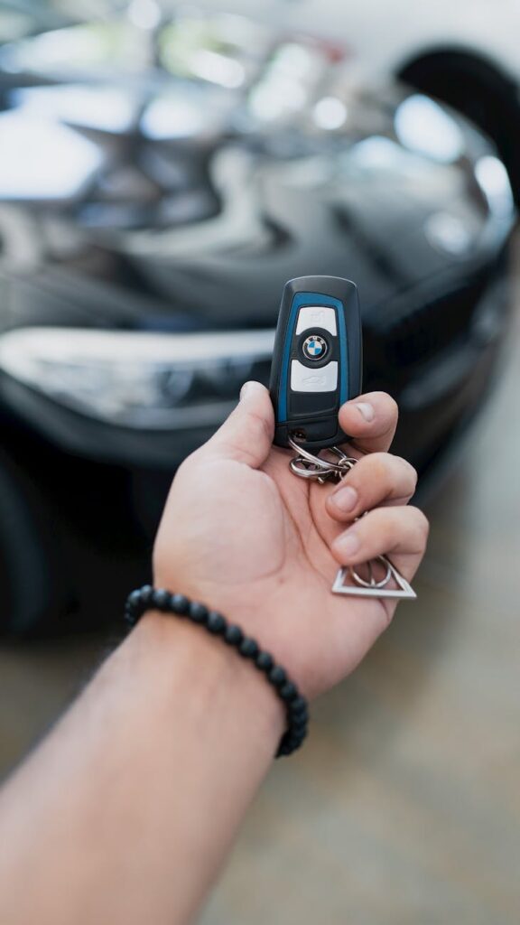 person holding a car key