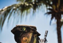 a man holding a rifle