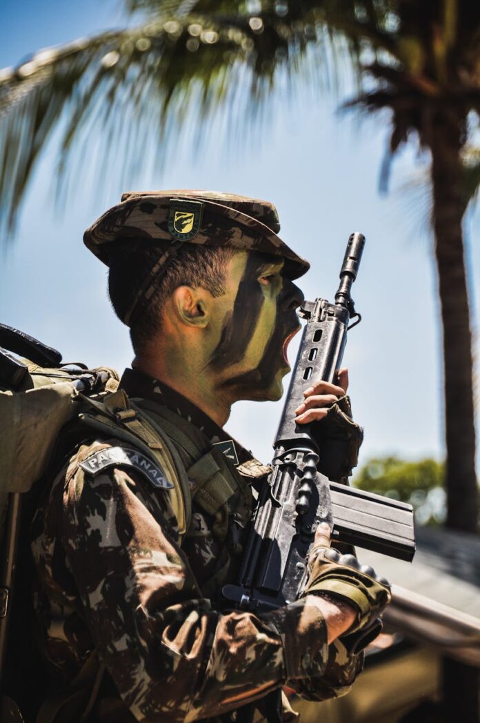 a man holding a rifle