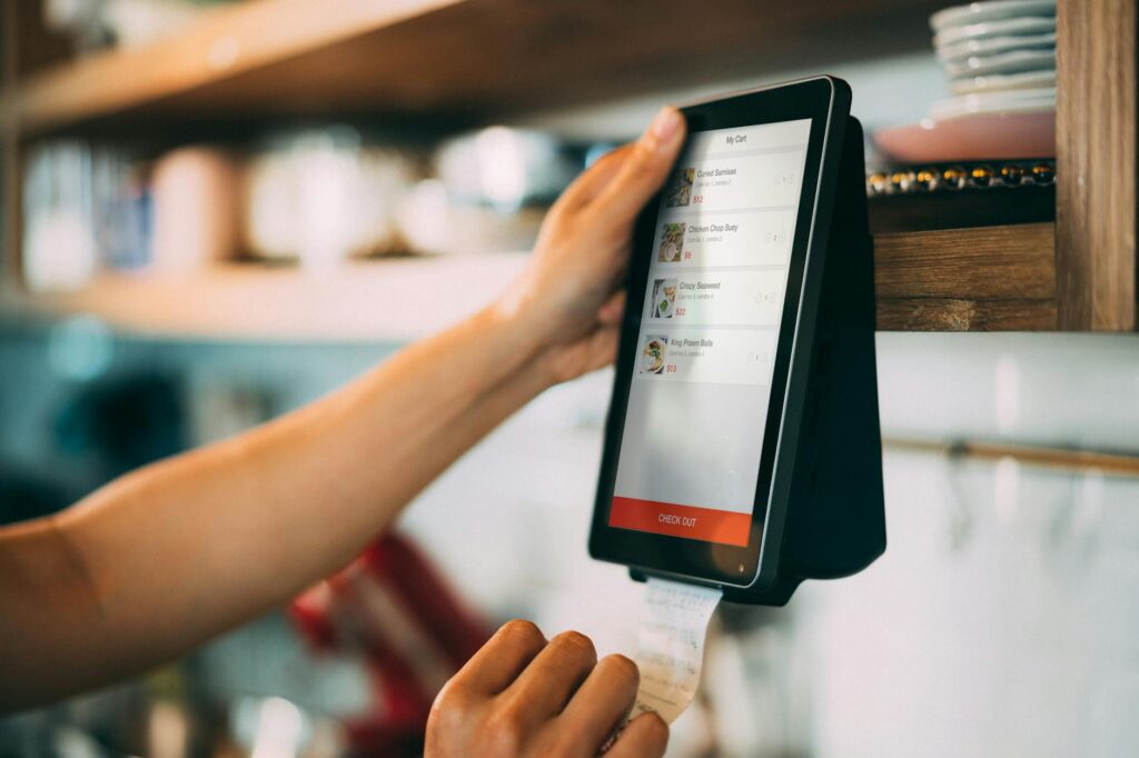 person holding a payment digital device