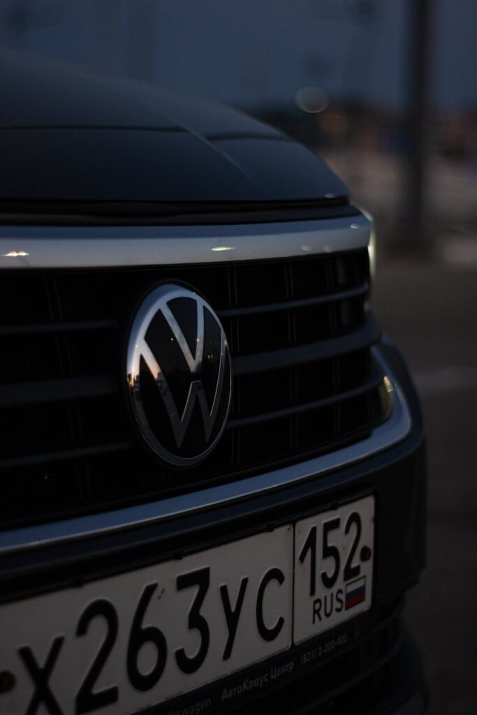 close up of the logo on the front of a volkswagen car