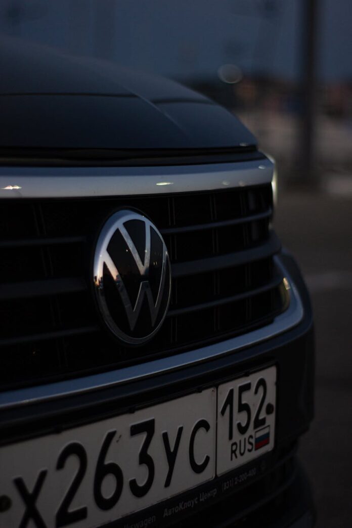 close up of the logo on the front of a volkswagen car