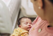 mother standing with baby