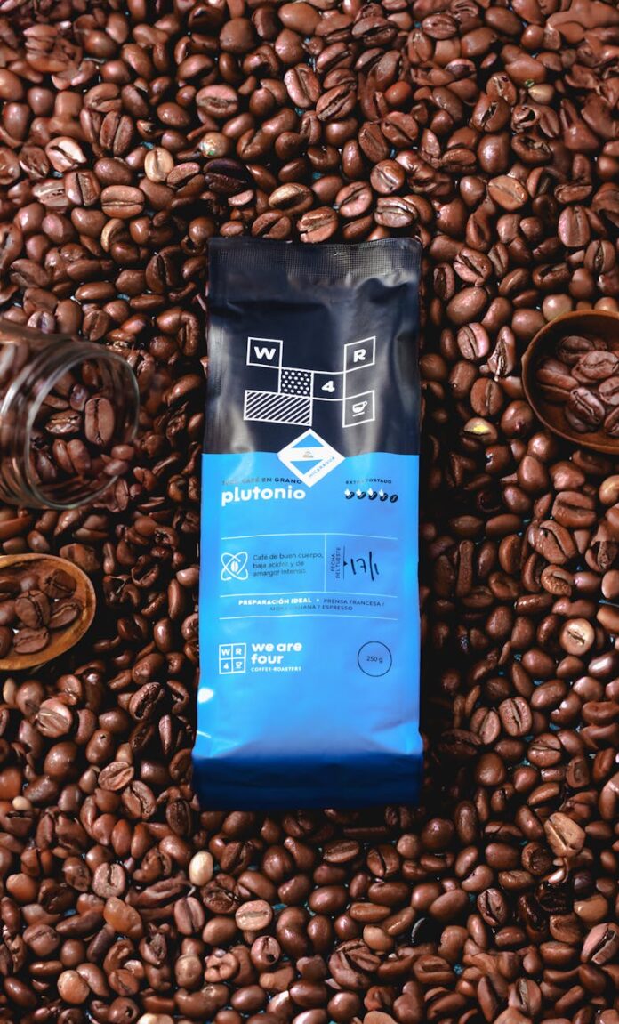coffee bag surrounded by roasted coffee beans