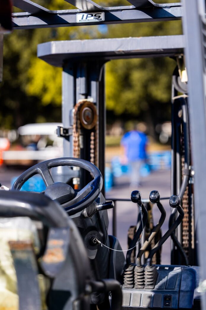 pexels-photo-34585145 close up of forklift steering wheel outdoors