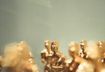 golden trophy statues at awards ceremony