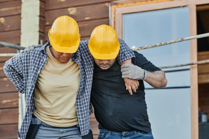 a worker supporting an injured co worker
