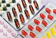 pink and yellow medication pill blister pack