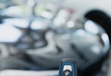 person holding a car key