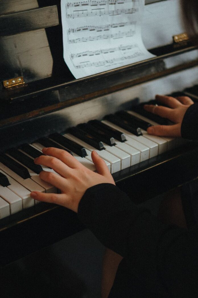 woman playing a piano