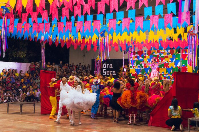 pexels-photo-12919854 dancers on a stage under vibrant colour decoration