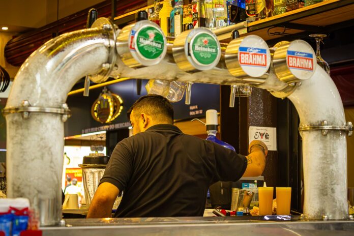 pexels-photo-33374850 bartender serving drinks at a busy bar