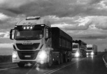 monochrome trucks on argentinian highway at dusk