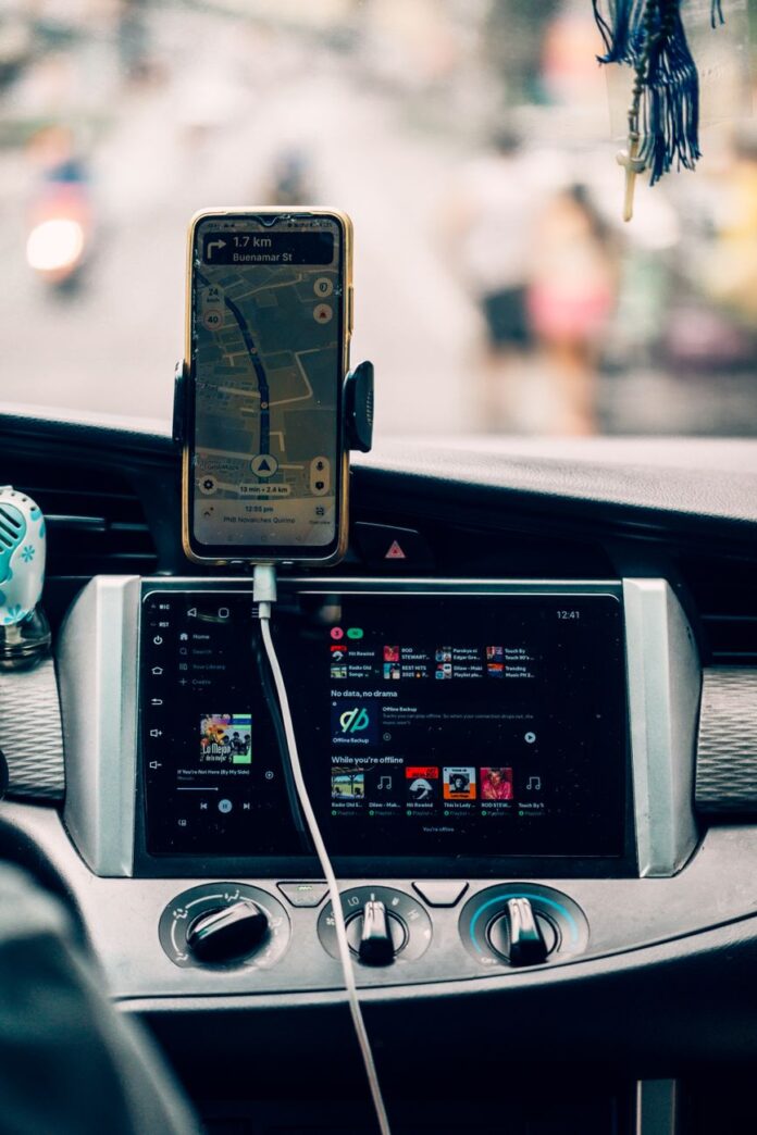 pexels-photo-35641865 car dashboard with gps and music interface