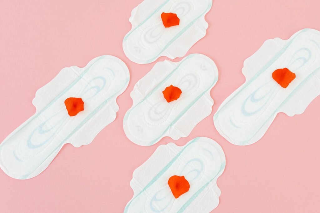 sanitary napkins on pink background