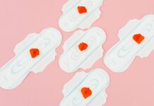 sanitary napkins on pink background