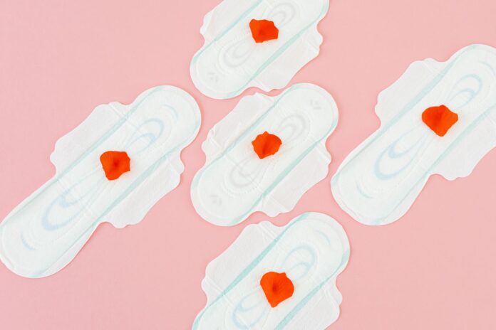 sanitary napkins on pink background