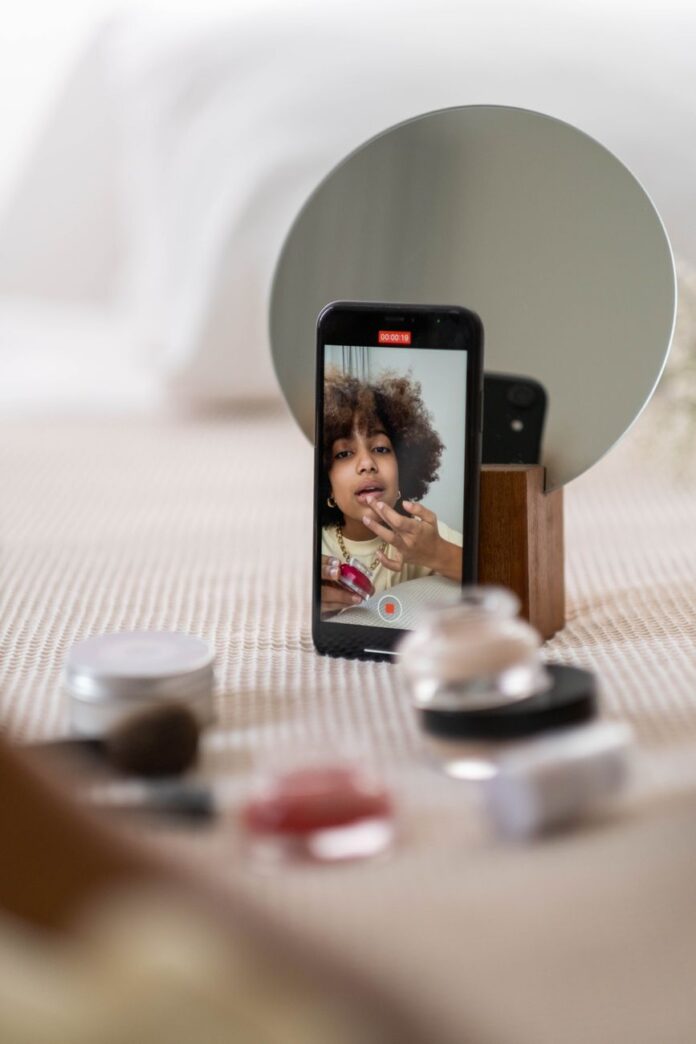 photo of woman on an iphone home screen